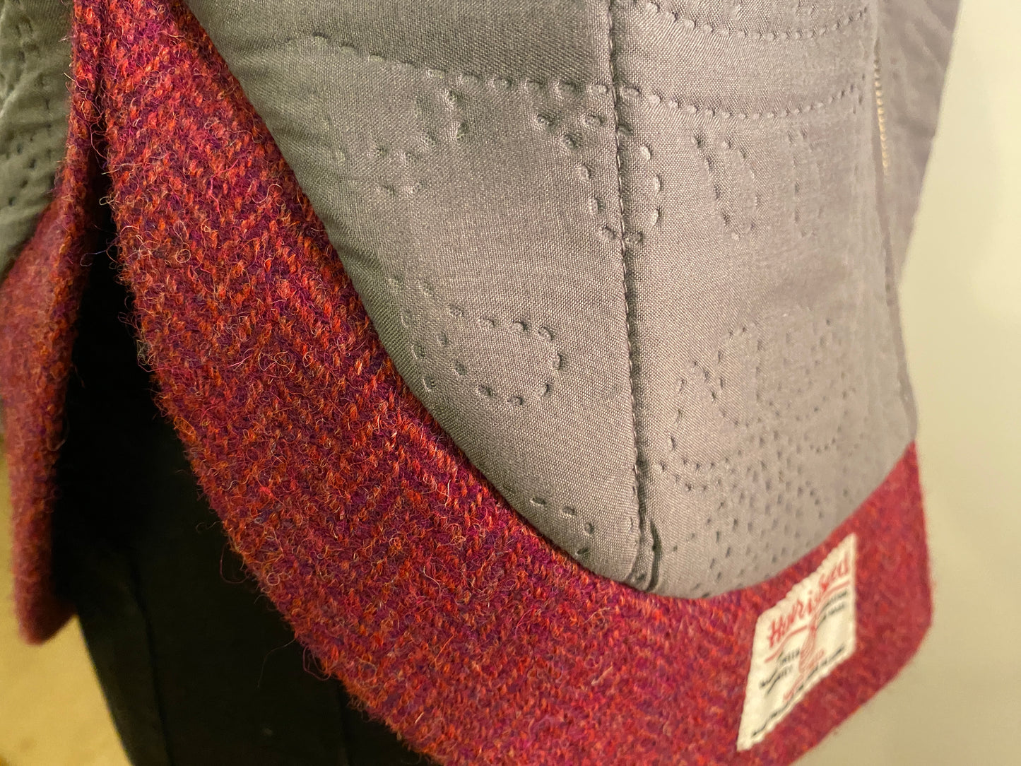 Rudraksha Jacket. Quilted Gray front with Burgundy Harris Tweed