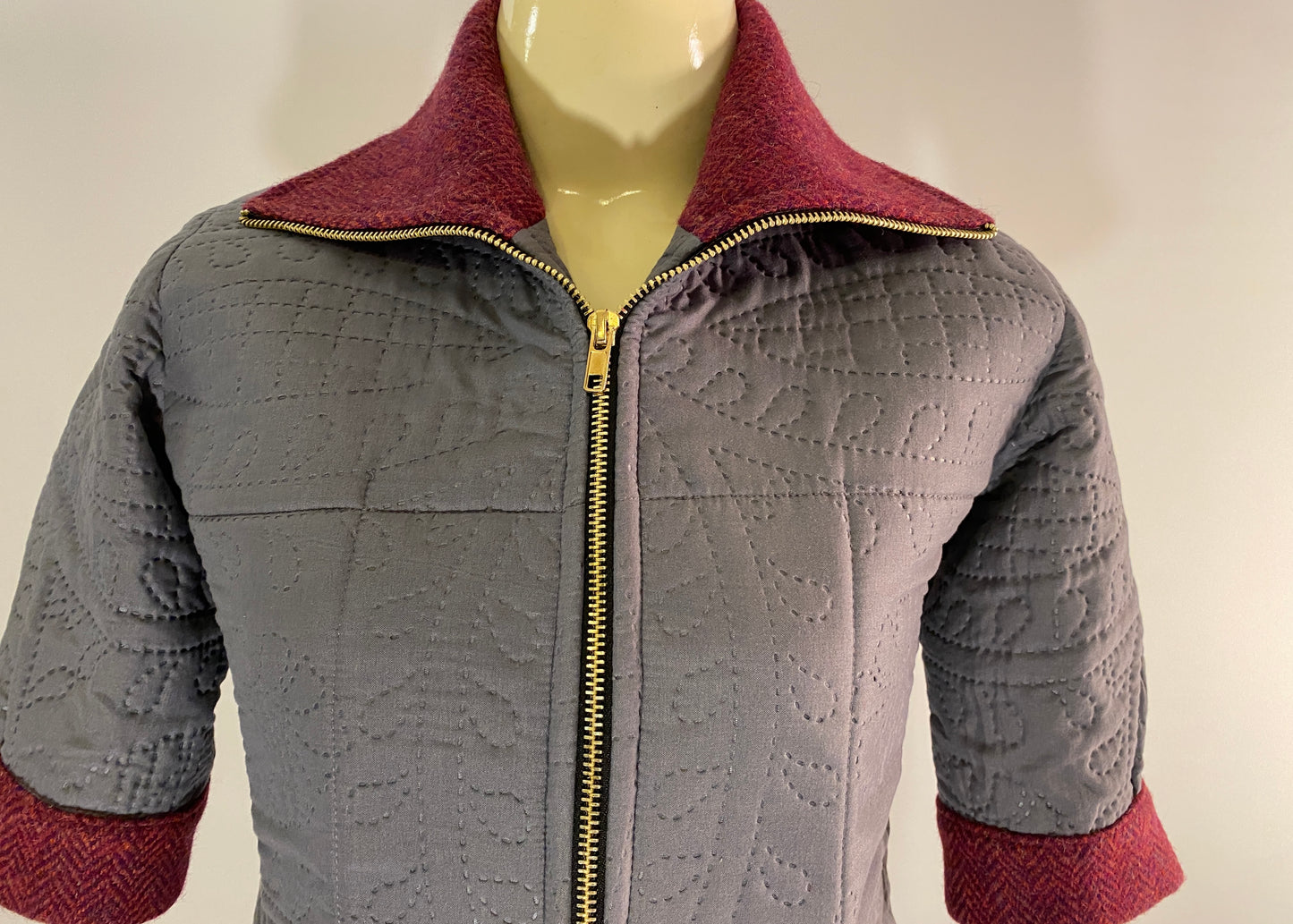 Rudraksha Jacket. Quilted Gray front with Burgundy Harris Tweed